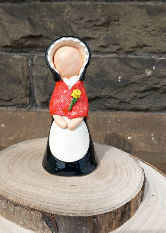 Ceramic Welsh Lady with daffodil brooch