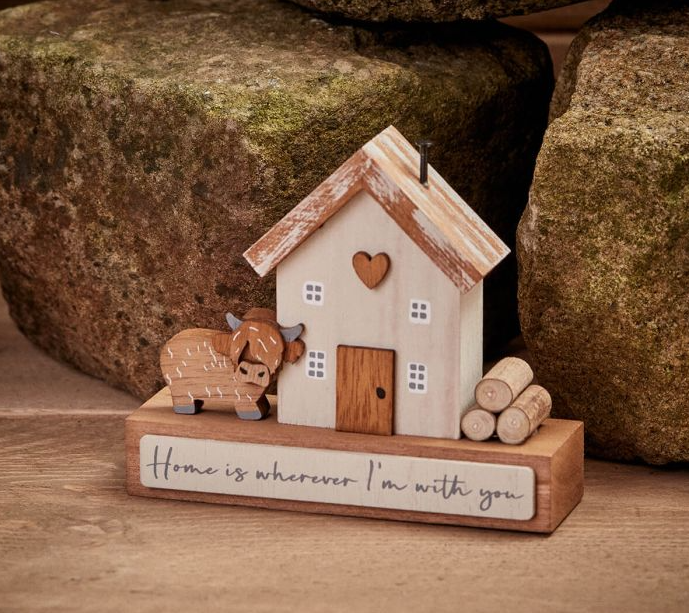 Highland cow house block with worded text