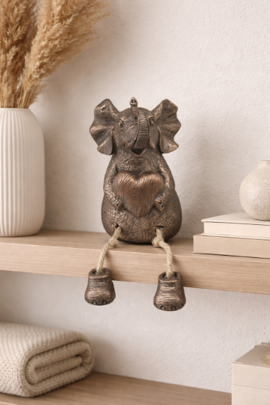 Tuskers, bronze sitting elephant