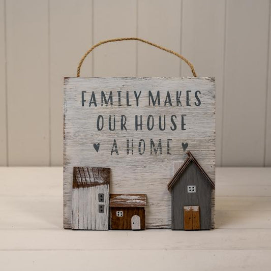 White Wooden Home Sign 'Family Makes Our House A Home' With Grey  White and Brown Stand Out Houses