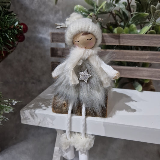 Winter girl on log